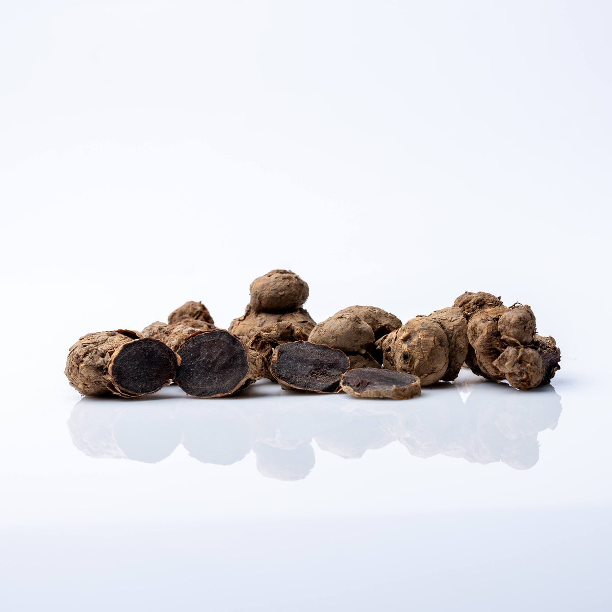 Whole dried black ginger rhizomes, Kaempferia parviflora, the root used in Marcapa Black Ginger